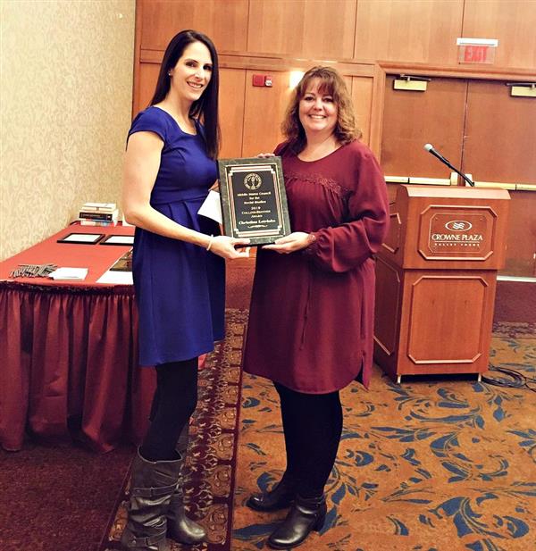 Christina Letrinko receives her award.